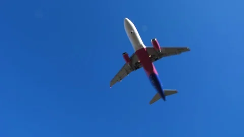 Airplane Flying Low when Approaching Airport Runway During Landing Slow Motion Stock Footage 104974221