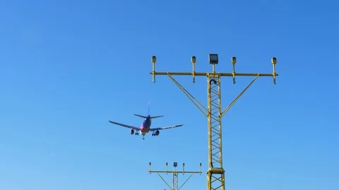Airplane Flying Low when Approaching Airport Runway During Landing Slow Motion Stock Footage 104974289