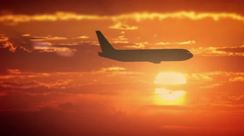 The Airplane is flying In The Orange Sky  Stock Footage 68096323