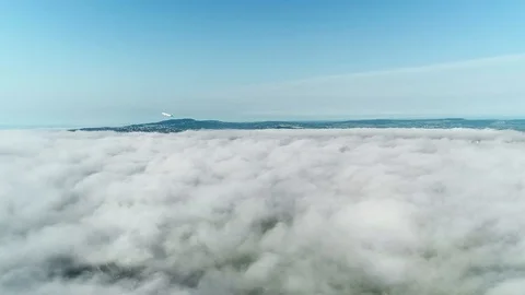 Airplane flying out from clouds into blue sky. Stock Footage 127166862