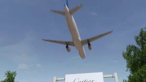 Airplane flying over advertising billboard with Cartier logo. Editorial 3D Stock Footage