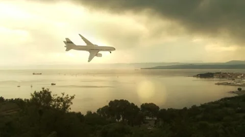 Airplane flying over bay Video stock 8998364