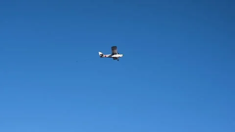 Airplane flying over the beach a clear day Stock Footage 267589466