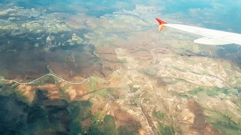 Airplane flying over the city, view from the window Stock Footage 104413456
