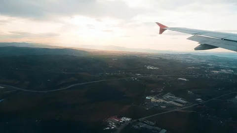 Airplane flying over the city, view from the window Stock Footage 104413745