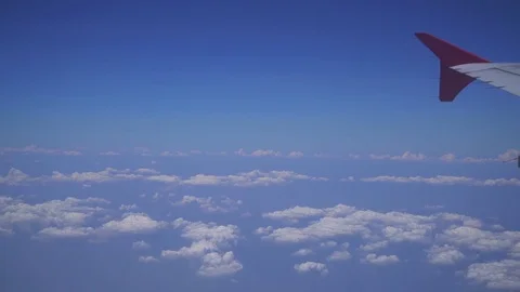 Airplane Flying over clouds Stock Footage 82698463