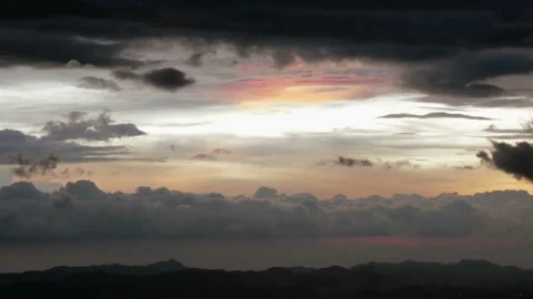 Airplane flying over the clouds in the sunset Stock Footage 134910825