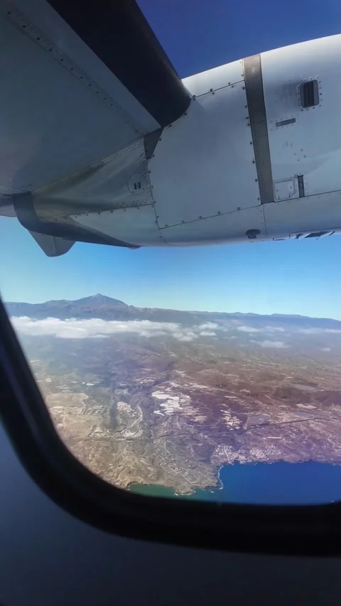 Airplane flying over the coast of Gran Canaria Stock Footage 345362268
