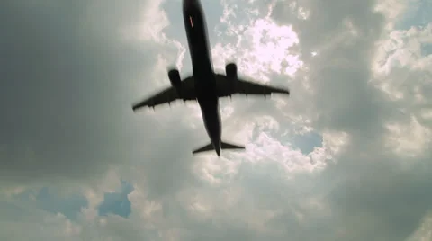 Airplane flying over head clouds cloudy Stock Footage 39179663