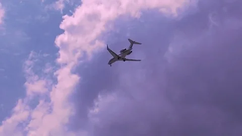 AIRPLANE FLYING OVER IBIZA'S BEACH Stock Footage