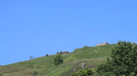 Airplane flying over a mountain Stock Footage 8568429