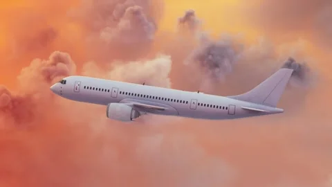 Airplane flying over pink clouds and going to meet the sun. Stock Footage 308995253