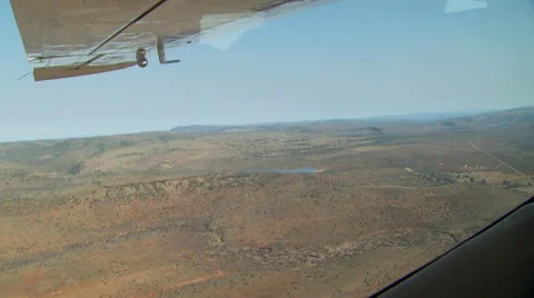 Airplane flying over ranch Stock Footage 54590537