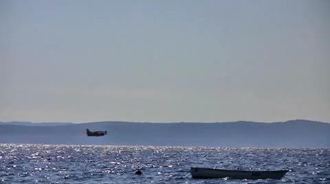 Airplane flying over sea Stock Footage 8915723