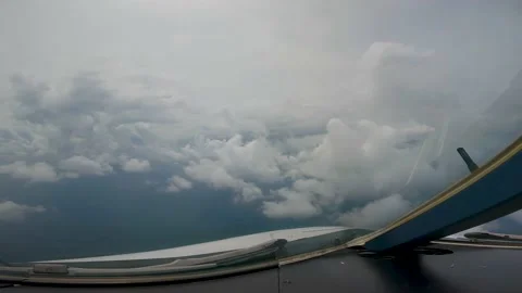 Airplane flying over the sky cloudy Stock Footage 231658050