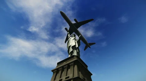 Airplane flying over the Statue of Liberty Stock Footage 38157053