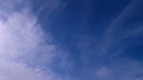 Airplane is flying overhead against cloudy sky. Stock Footage 74595675