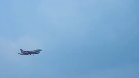 Airplane flying overhead against  cloudy sky background.  Stock Footage 233278282