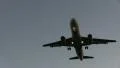 Airplane flying overhead at dusk HD Footage