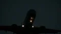 Airplane flying overhead at night HD Footage