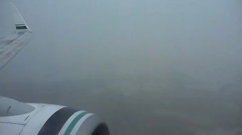 Airplane Flying in Rain Storm Stock Footage 7136197