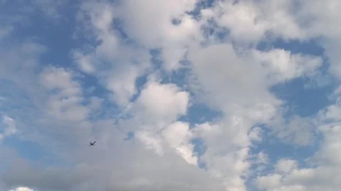 Airplane Flying in Sky Above Clouds at High Altitude Stock Footage 337246833
