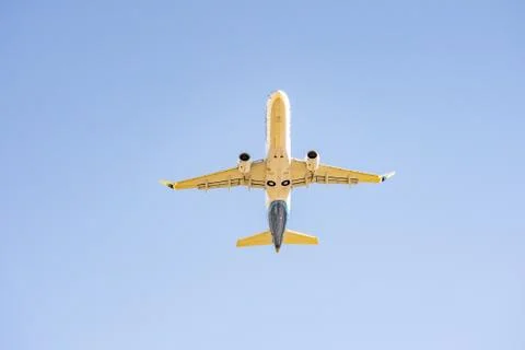 Airplane Flying in the Sky Stock Photos
