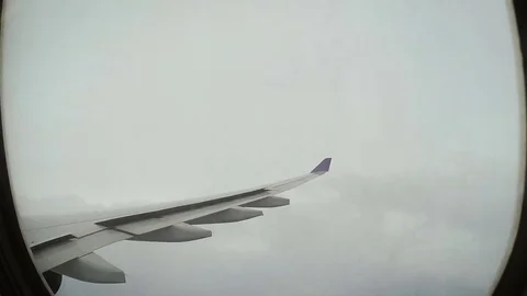 Airplane flying in stormy sky Stock Footage 79476559