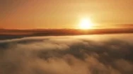 Airplane Flying Into Sunrise Clouds Aerial Nature View Stock Footage