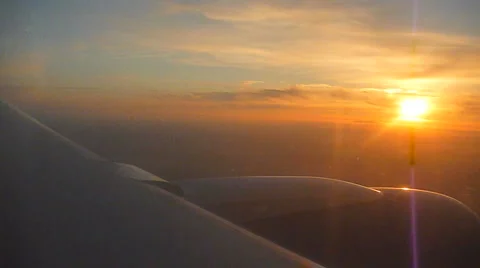 Airplane Flying at Sunset Stock Footage 978345