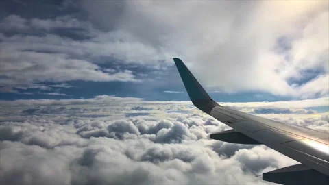 Airplane Flying Through Clouds Stock Footage