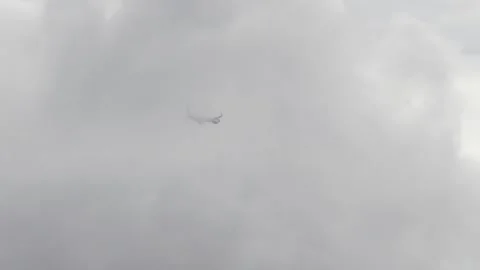 Airplane flying through clouds Stock Footage 201420700