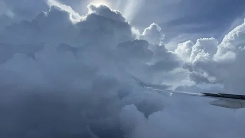 Airplane flying through the clouds Stock Footage 256965844