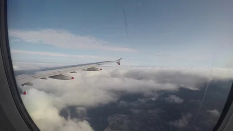 Airplane Flying Through Clouds Window POV Timelapse Video stock 83832221