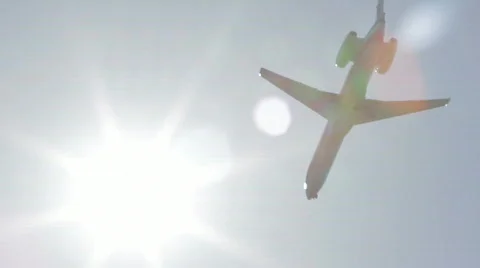 Airplane Flying Through Sun HD Stock Footage 701341