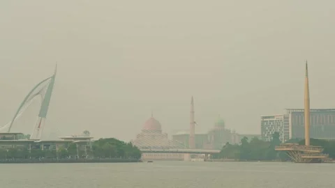 Airplane flying towards camera in Putrajaya during airshow in the evening Video stock 346336235