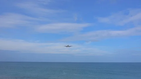 Airplane flying under blue sky Stock Footage 87027675