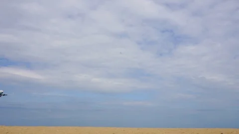 Airplane flying under blue sky Stock Footage 87027708