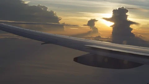 Airplane flying view from inside window on sunset time. Beautiful horizon Stock Footage 126642881