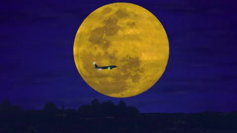 Airplane in front of full moon light at night (4K) Video stock 222736916