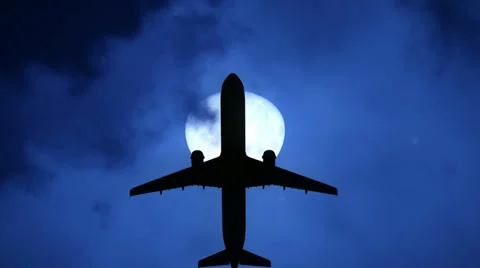 Airplane at the full moon Stock Footage 34477841