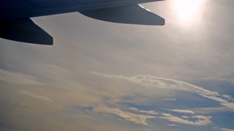 Airplane Fuselage in the Sky with Clouds on the Background Stock Footage 89413018