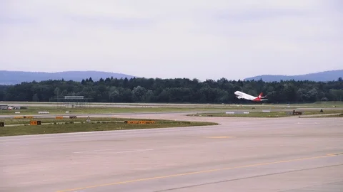 Airplane is gaining speed while moving along the runway, Plane takes off. 4K Stock Footage 121324511