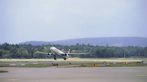 Airplane is gaining speed while moving along the runway, Plane takes off. 4K Video stock 121571436