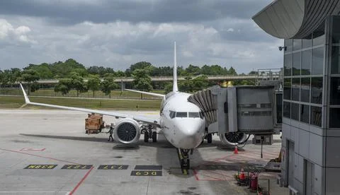 Airplane at gate getting ready for flight - travel concept Stock Photos