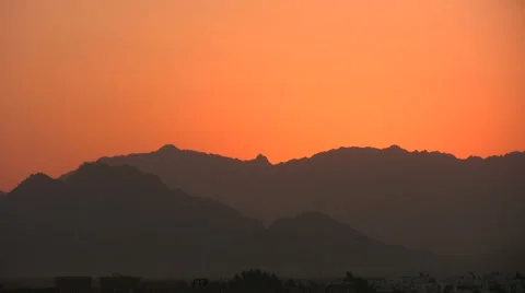 Airplane glides across sunset sky Stock-Footage 61176144