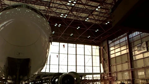 Airplane in hangar Stock Footage 77129433