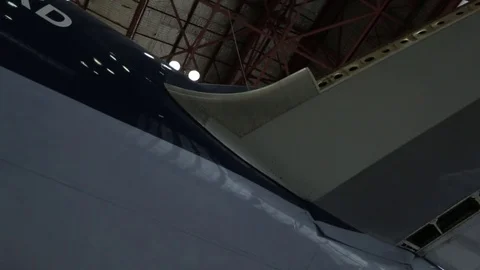 Airplane in hangar Stock Footage 77129440
