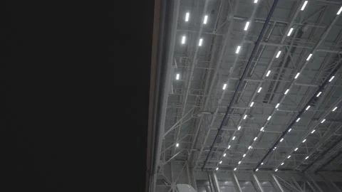 Airplane hangar gate opens Stock Footage 165250329