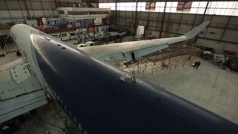 Airplane in hanger Stock Footage 77129432
